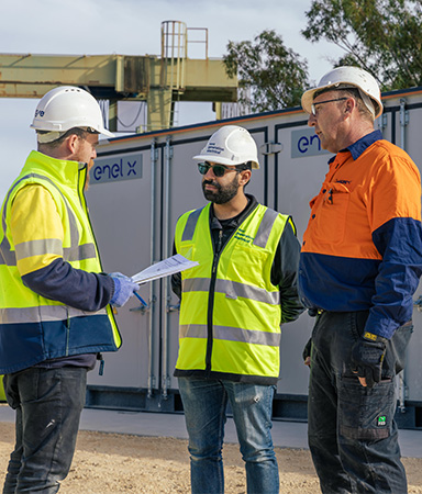 Enel X and CIT staff discussing about the project in front of the Battery Storage