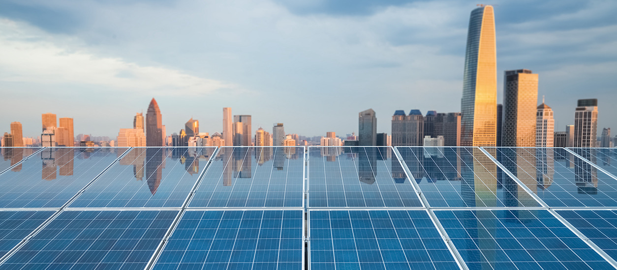 solar panels reflecting a city skyline