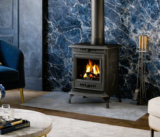 Traditional wood-burning stove with a lit fire in a modern living room