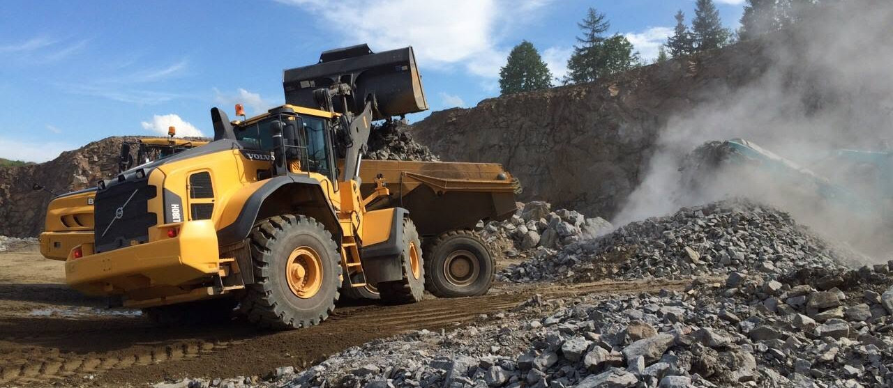 Wheel loader moving crushed rock at a quarry