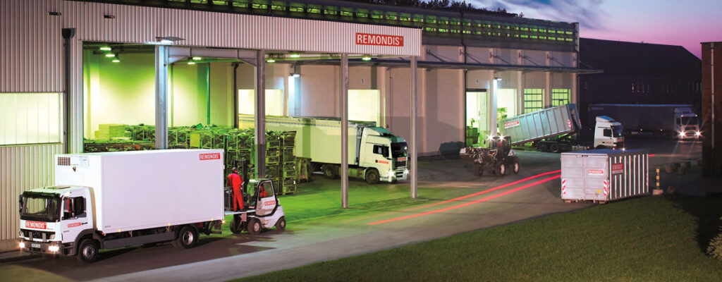 Waste management and recycling facility with trucks operating at loading bays