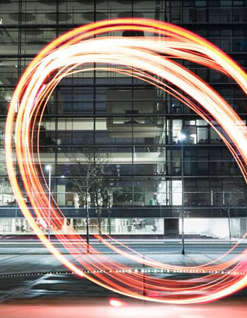 Abstract circle of light in front of office building