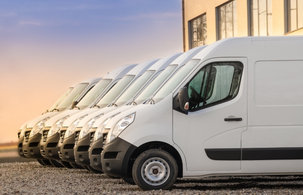 commercial electric vehicles parked in a row