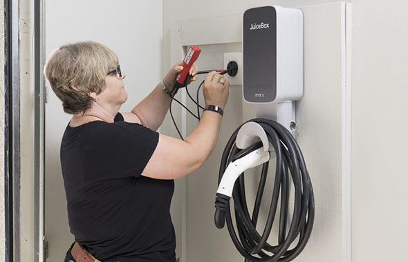 woman installing JuiceBox charger