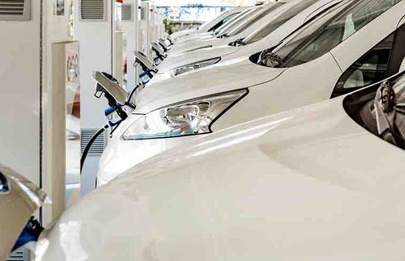 Row of electric vehicles charging