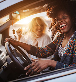 friends driving and laughing