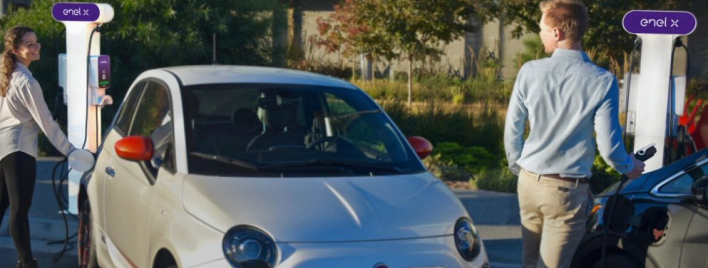 Woman charging electric vehicle