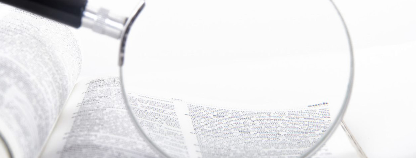 Magnifying glass over data sheet