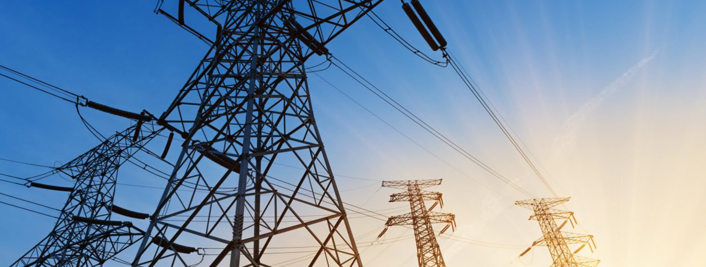 Power lines against blue sky